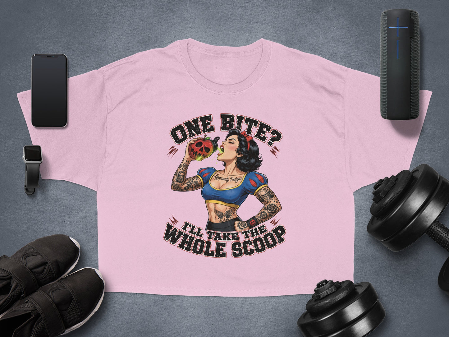 Pink cropped t-shirt with "One Bite? I'll Take The Whole Scoop" and a tattooed Snow White biting an apple.