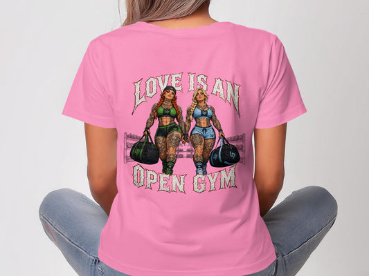 Two women in athletic wear carrying gym bags, text reads "LOVE IS AN OPEN GYM".