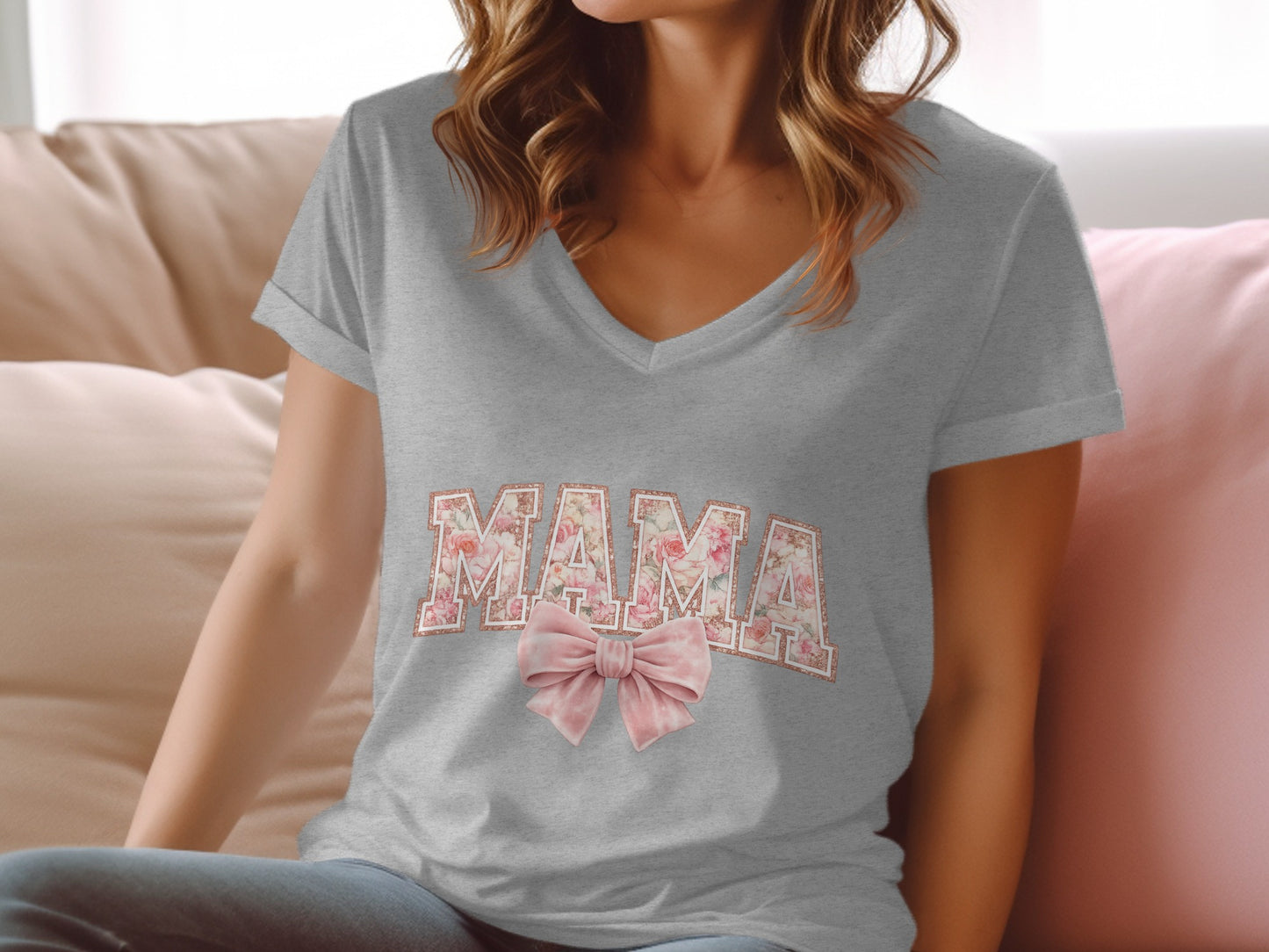 Grey v-neck t-shirt with "MAMA" in floral pattern and pink bow.