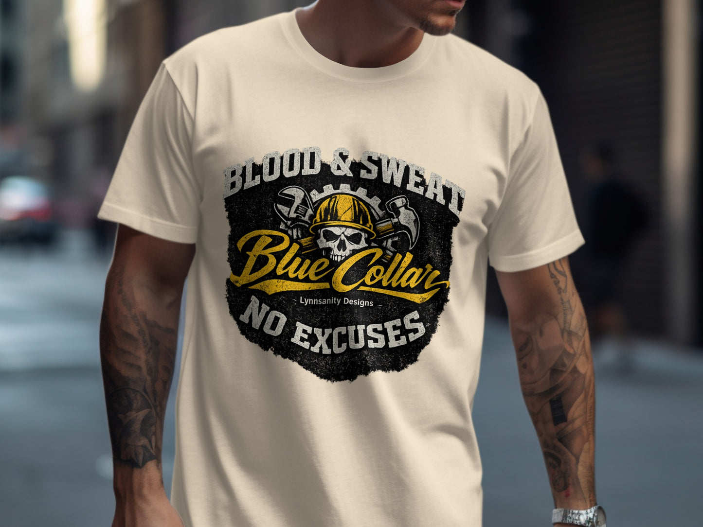 Cream t-shirt with "Blood & Sweat, Blue Collar, No Excuses" text and skull graphic.