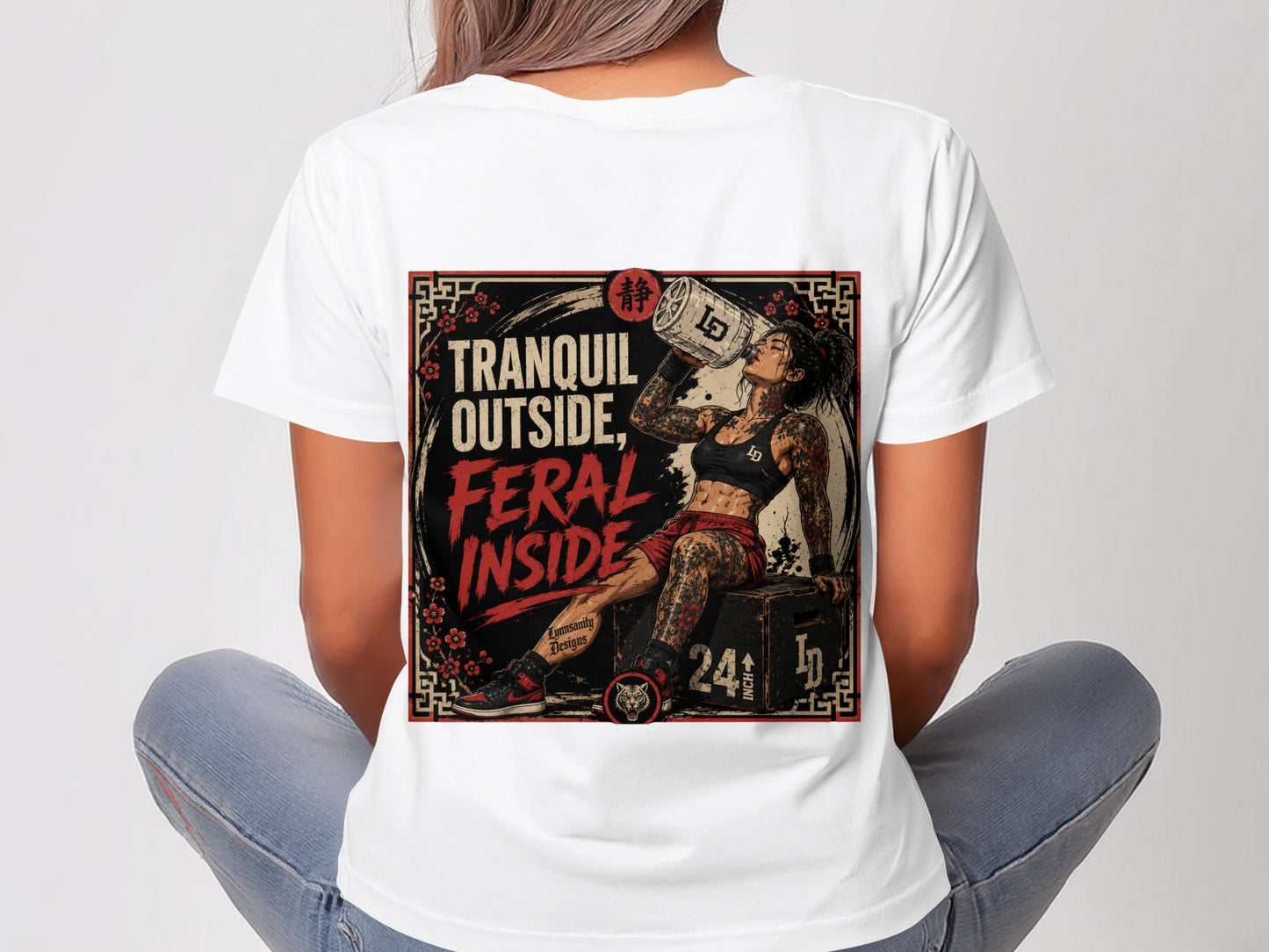 Woman in white t-shirt with "TRANQUIL OUTSIDE, FERAL INSIDE" graphic.