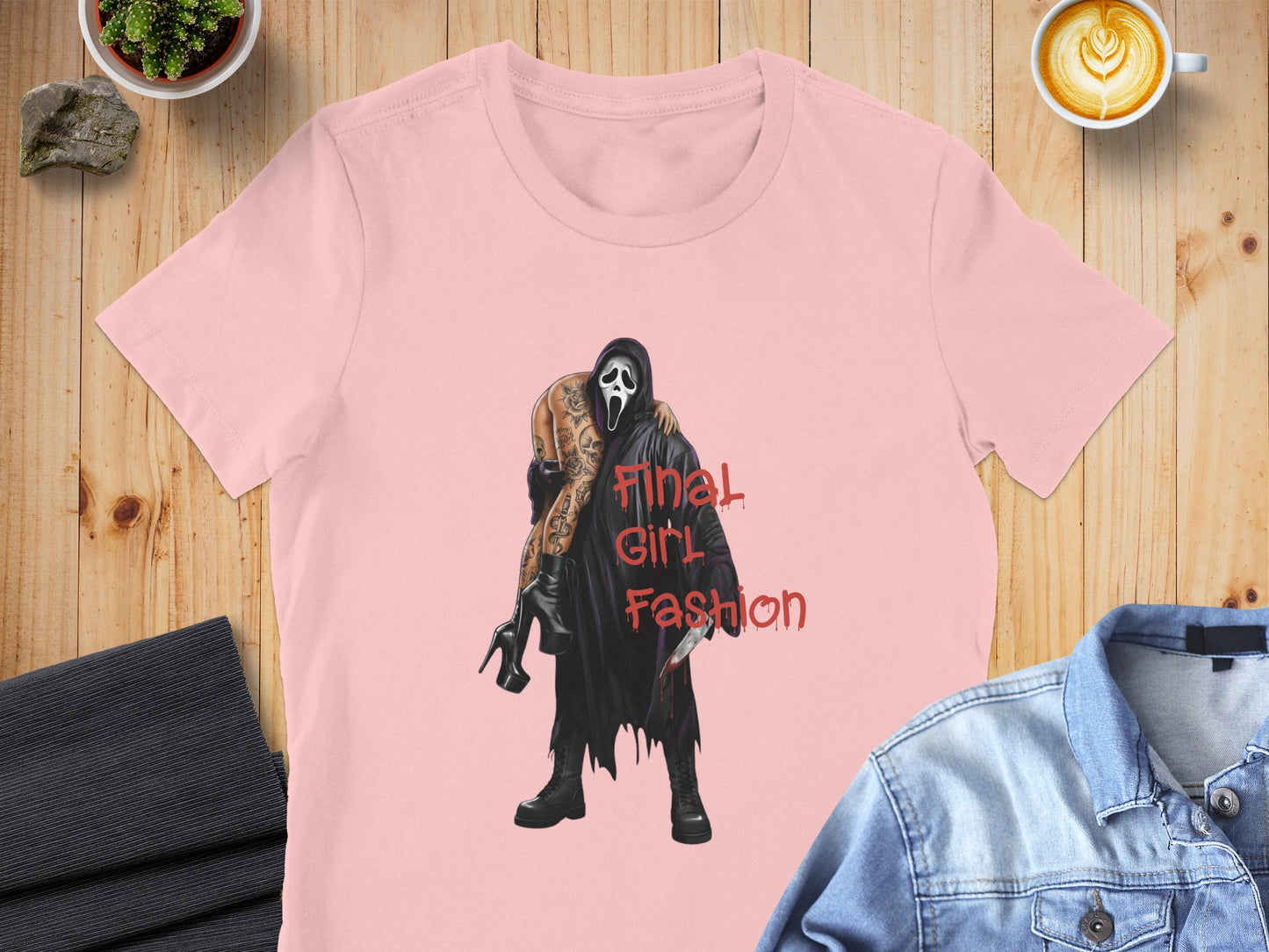 Pink t-shirt with "Final Girl Fashion" and a screaming ghost character holding a bloody knife.