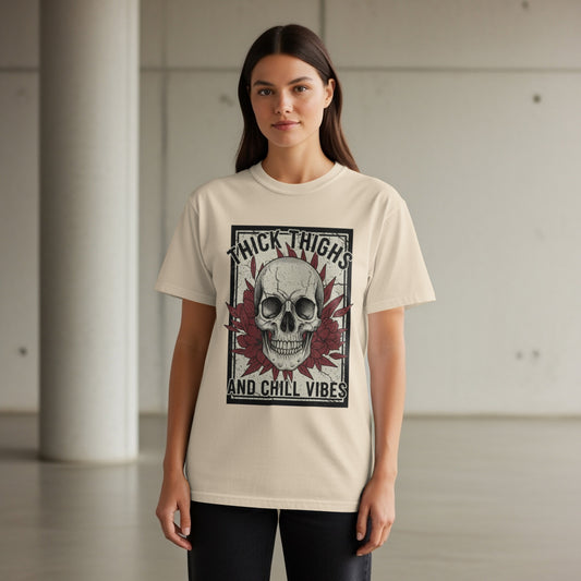 Cream t-shirt with skull and floral design that says "Thick Thighs And Chill Vibes".