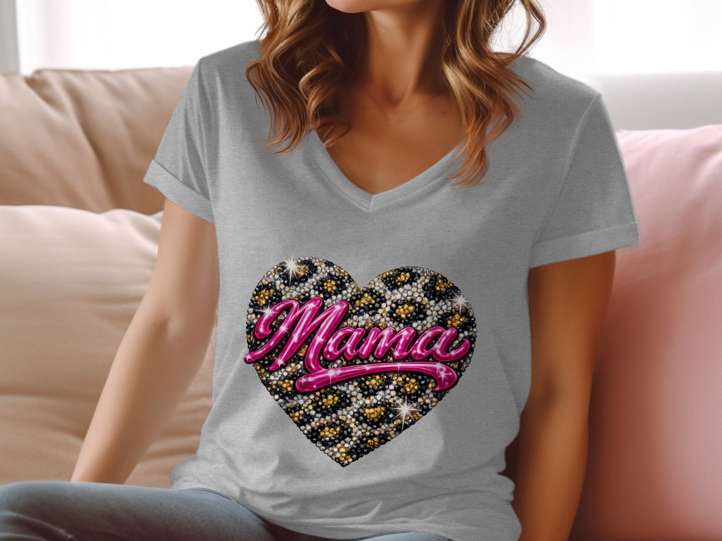 Grey v-neck t-shirt with sparkly pink "Mama" text inside a leopard print heart.