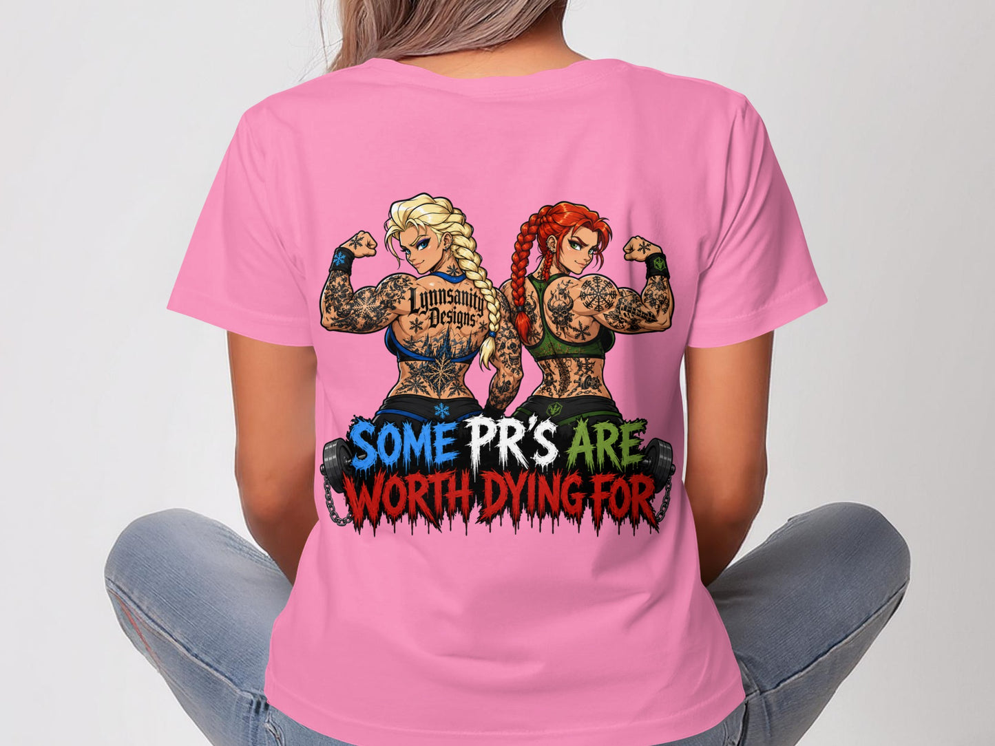 Two tattooed women flex muscles, wearing shirts with "SOME PR'S ARE WORTH DYING FOR".