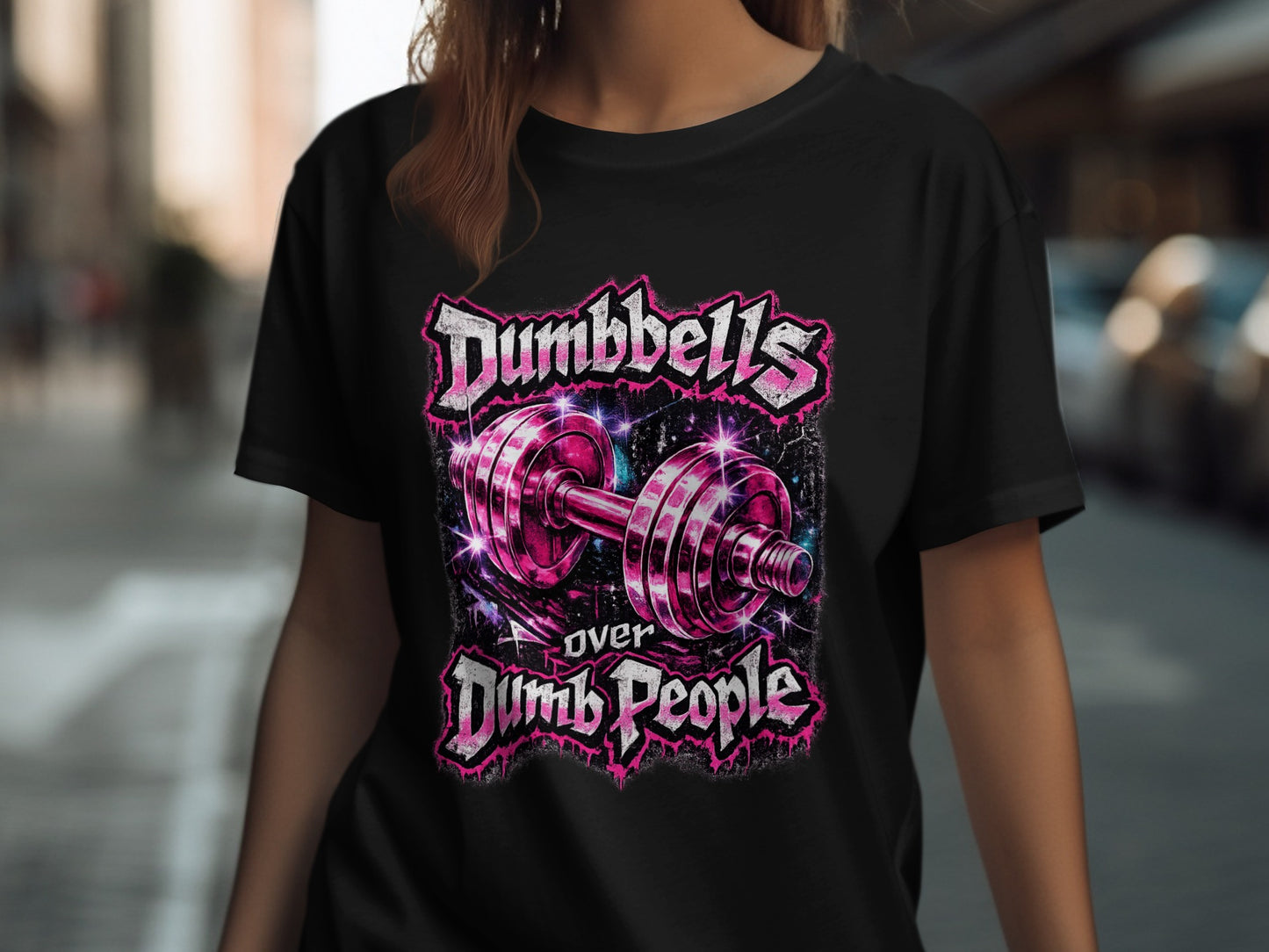 Black t-shirt with "Dumbbells Over Dumb People" text and pink dumbbell graphic.