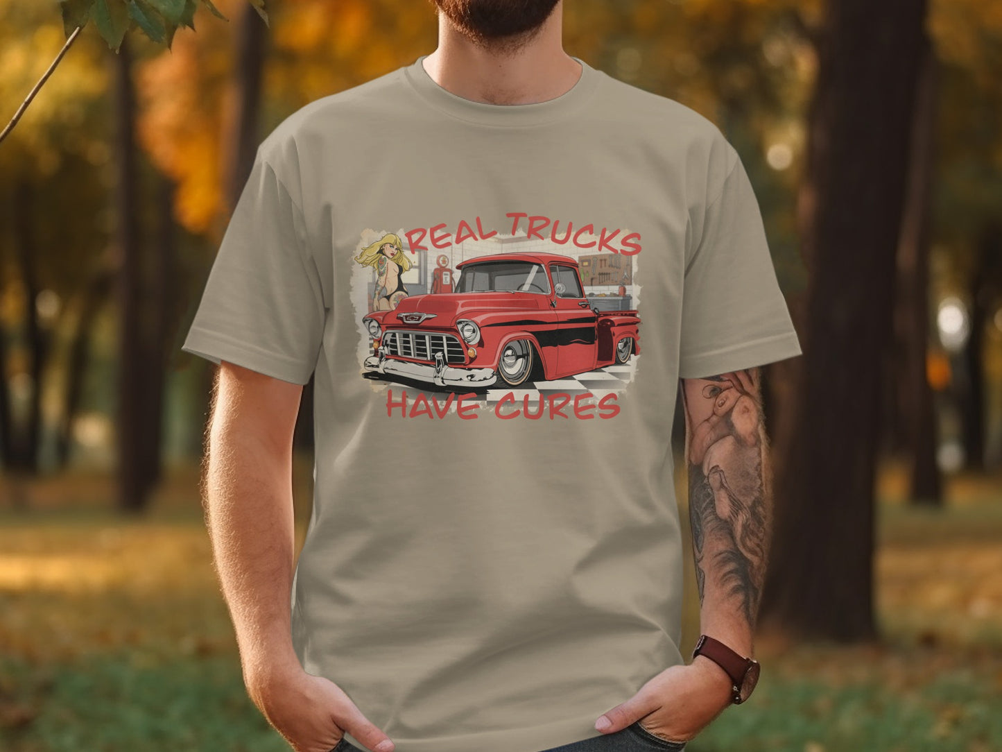 T-shirt with graphic of red classic truck and text "Real Trucks Have Cures".