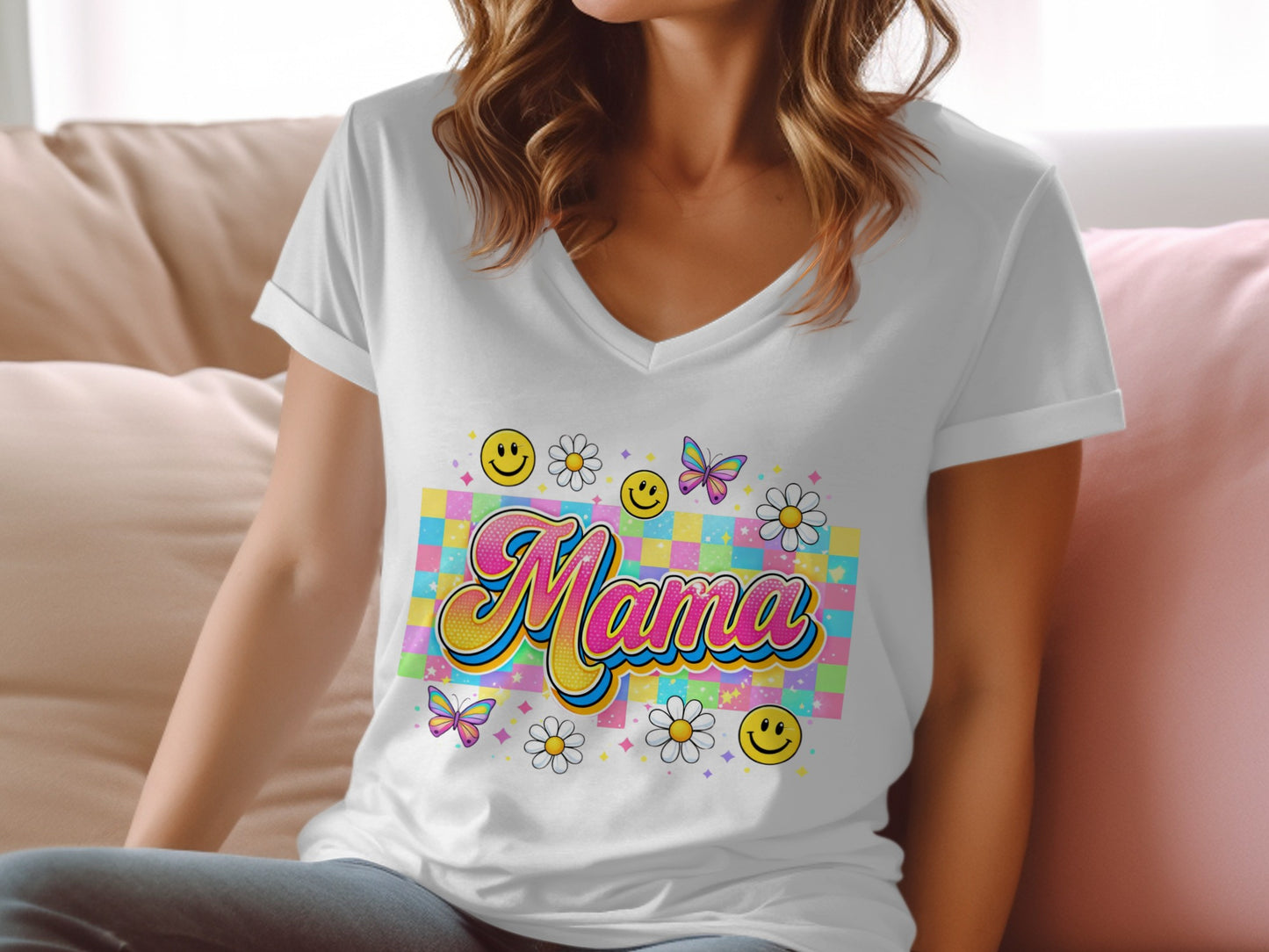 White v-neck t-shirt with "Mama" design featuring smiley faces, daisies, and butterflies.