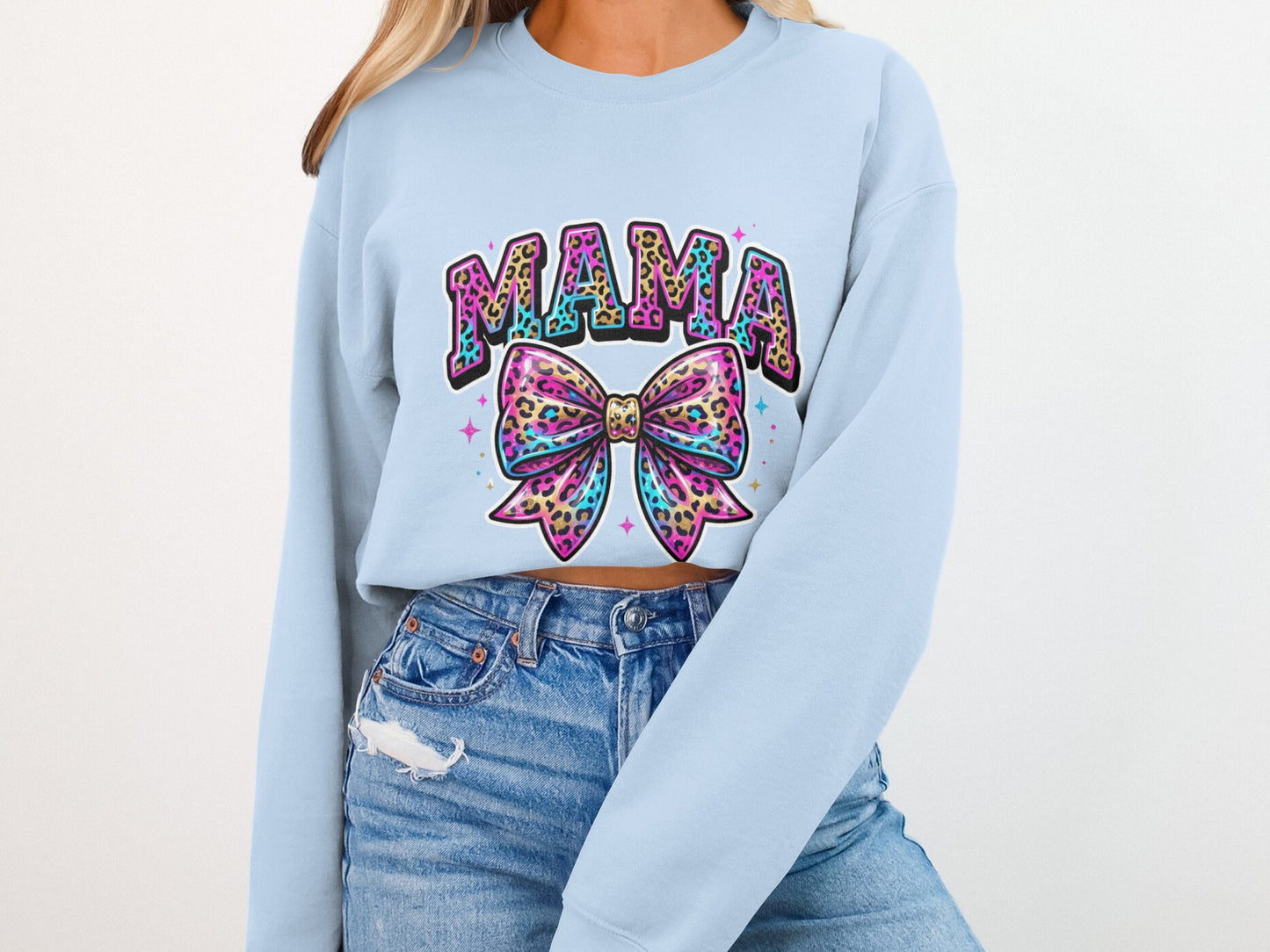 Light blue sweatshirt with "MAMA" text and a colorful leopard print bow graphic.