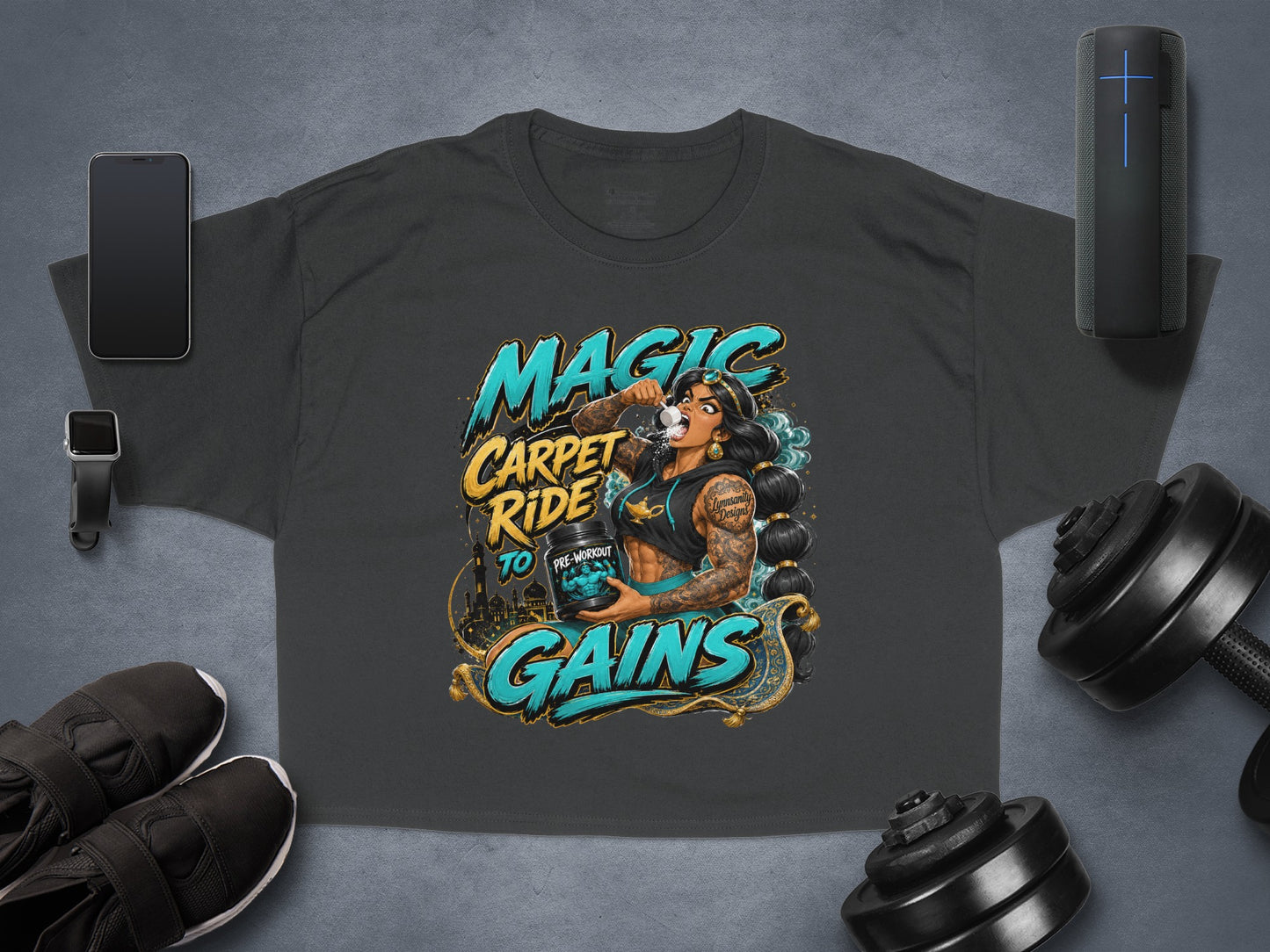 Dark grey t-shirt with "Magic Carpet Ride to Gains" text and a woman drinking pre-workout.