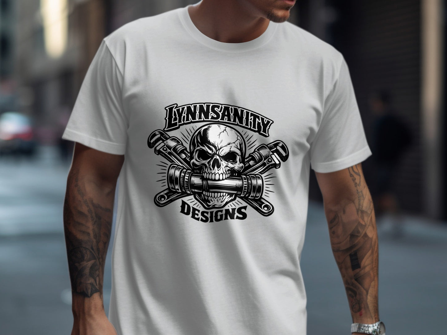 White t-shirt with skull and wrenches logo, "LYNNSANITY DESIGNS".