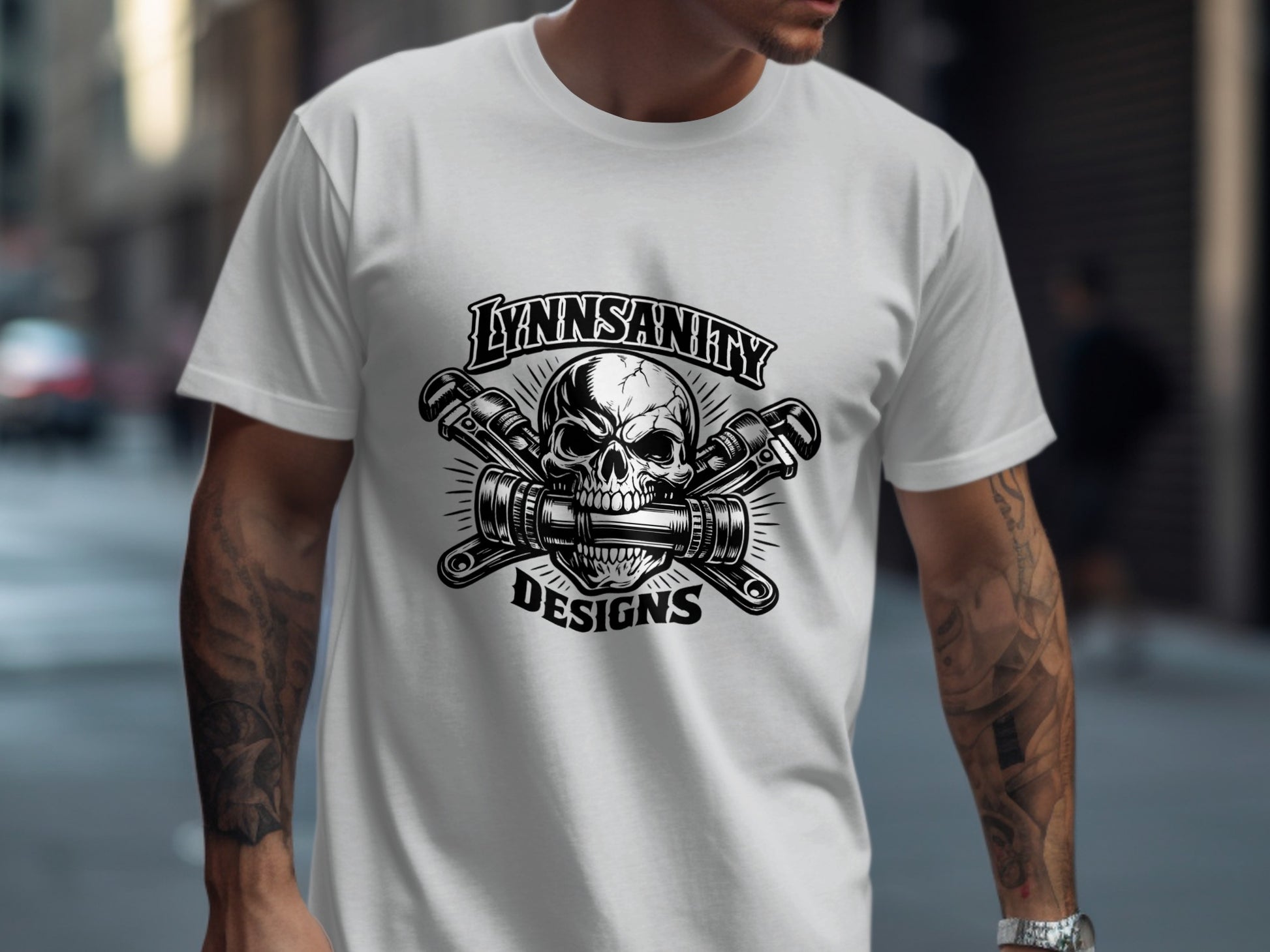 White t-shirt with skull and wrenches logo, "LYNNSANITY DESIGNS".