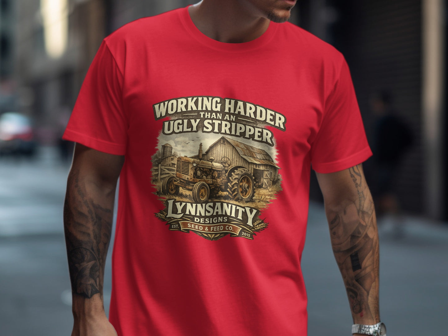 Red t-shirt with "Working Harder Than An Ugly Stripper" and farm tractor graphic.