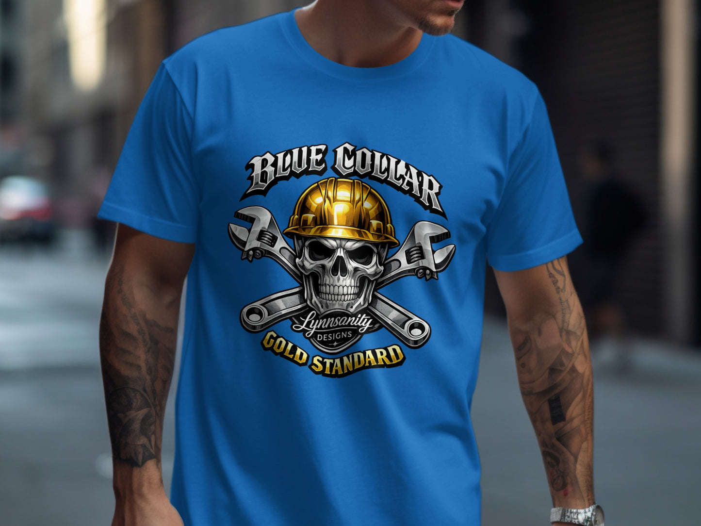 Blue Collar Gold Standard skull graphic on a blue t-shirt.