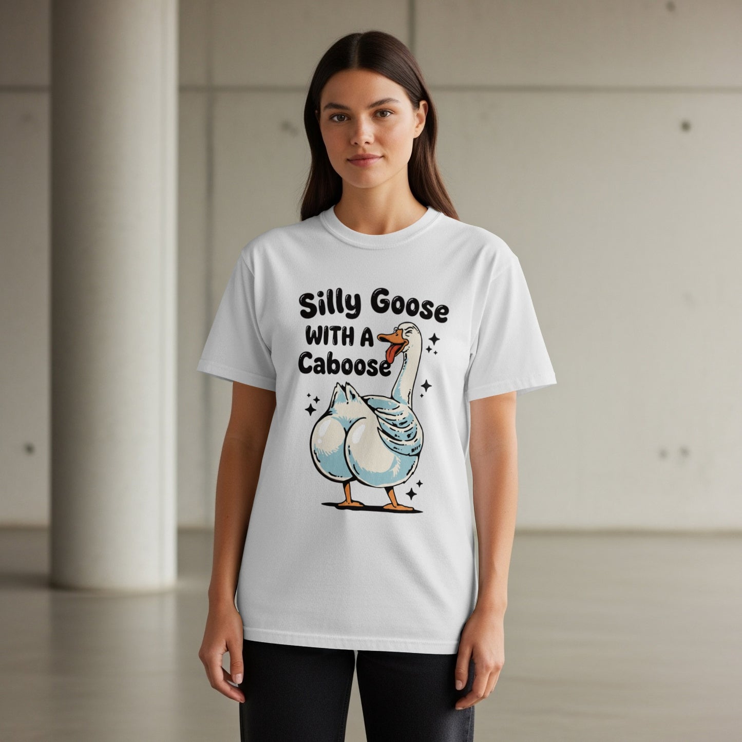 White t-shirt with "Silly Goose with a Caboose" text and cartoon goose graphic.