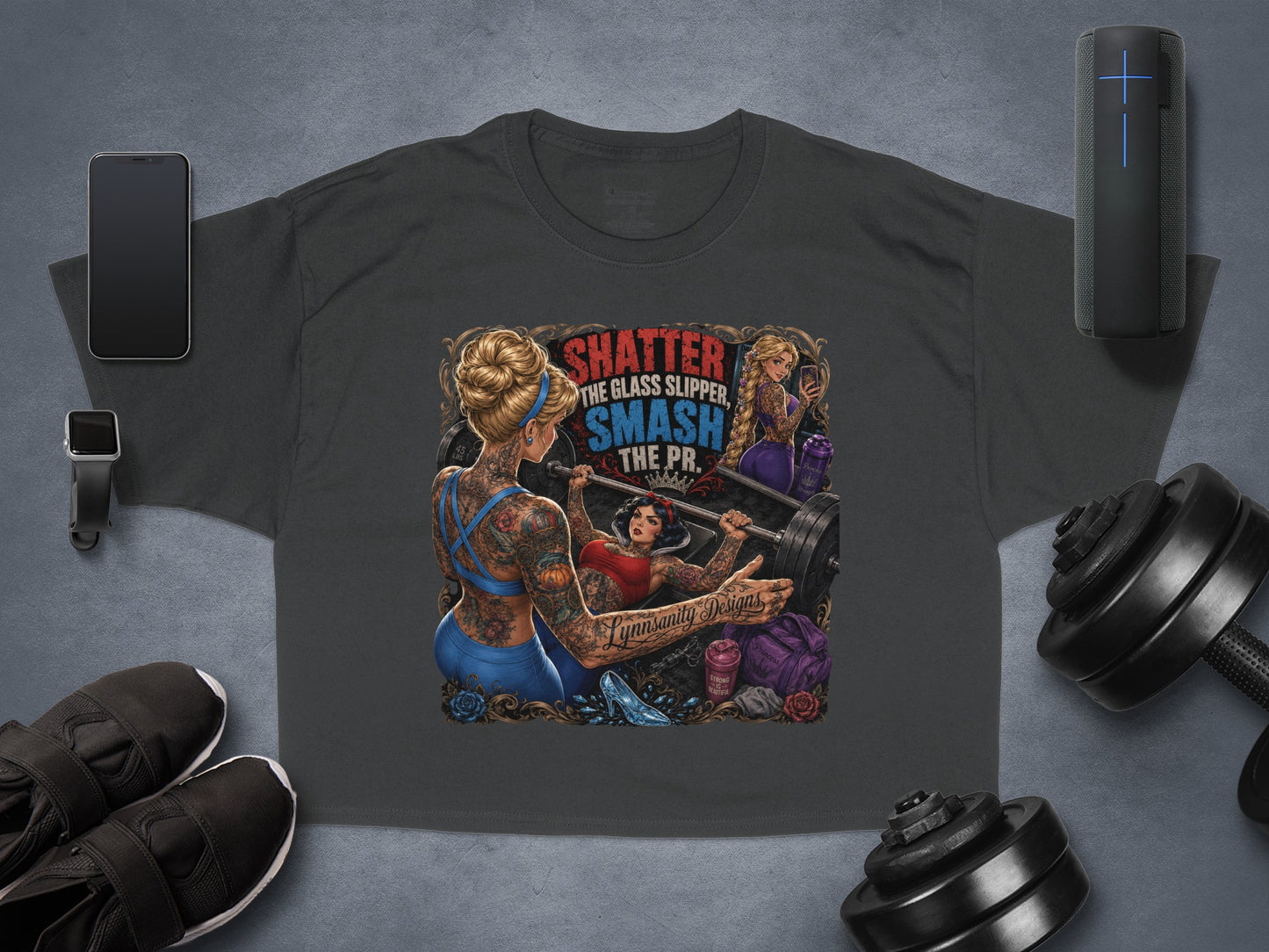 T-shirt with tattooed Snow White lifting weights, text "Shatter the Glass Slipper. Smash the PR."