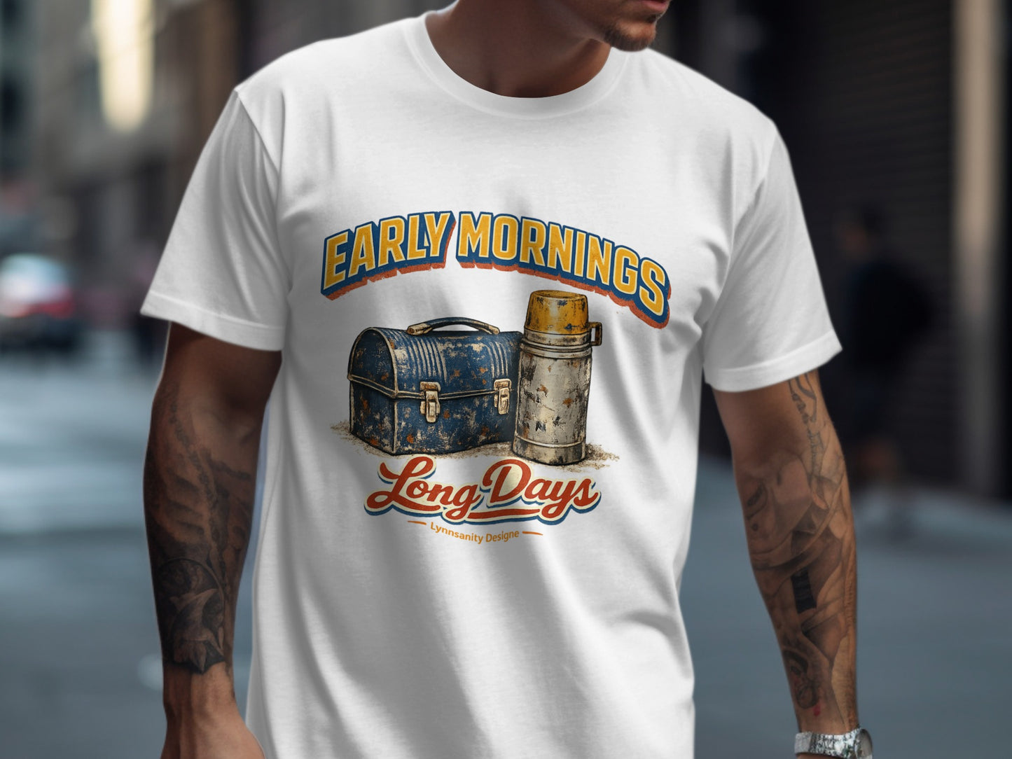 White t-shirt with "Early Mornings Long Days" and vintage lunchbox and thermos graphic.