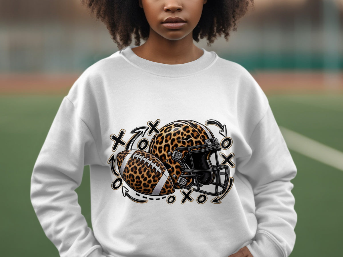 White sweatshirt with leopard print football and helmet graphic.