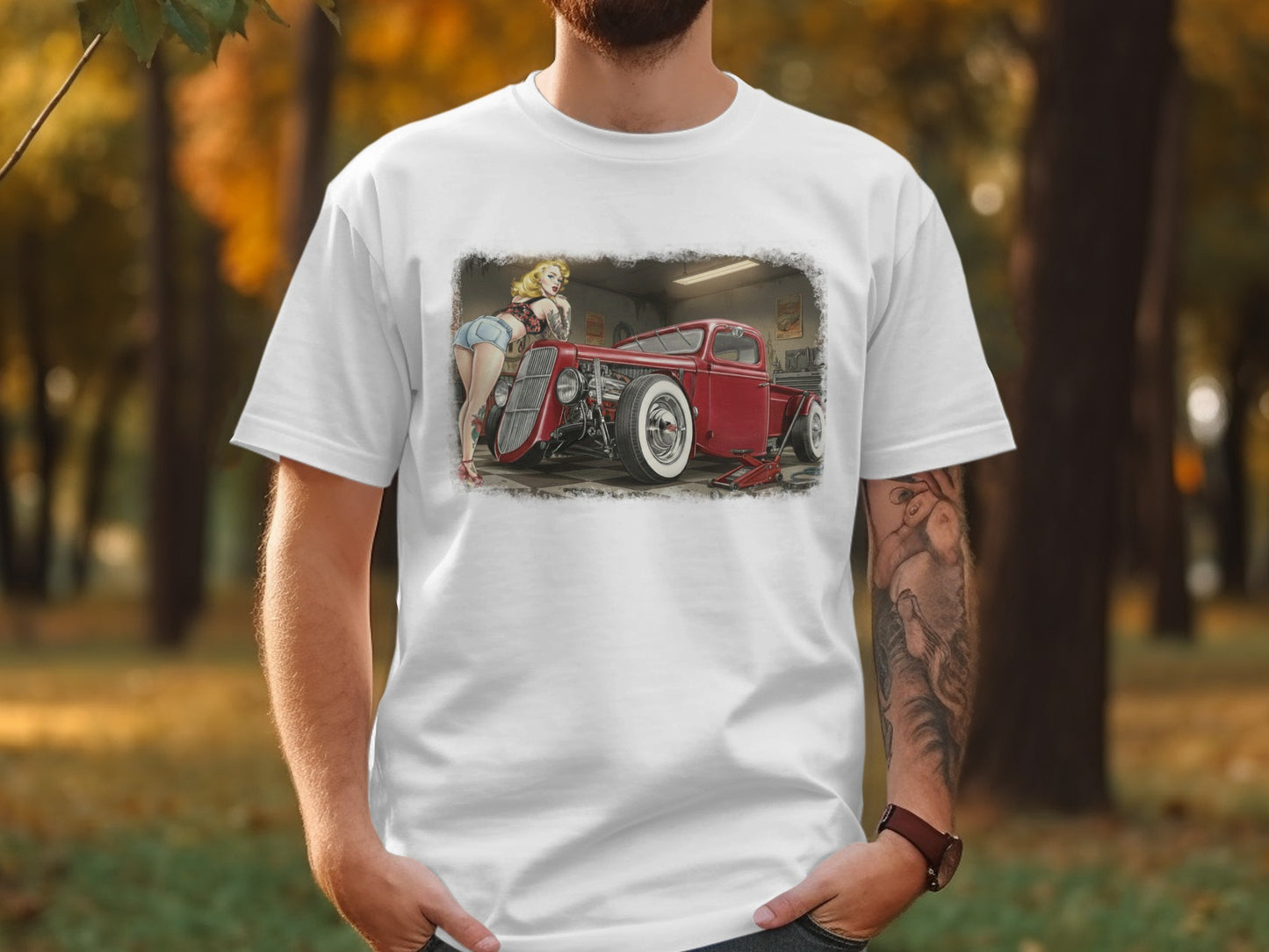 T-shirt with a pin-up girl posing by a red hot rod car.