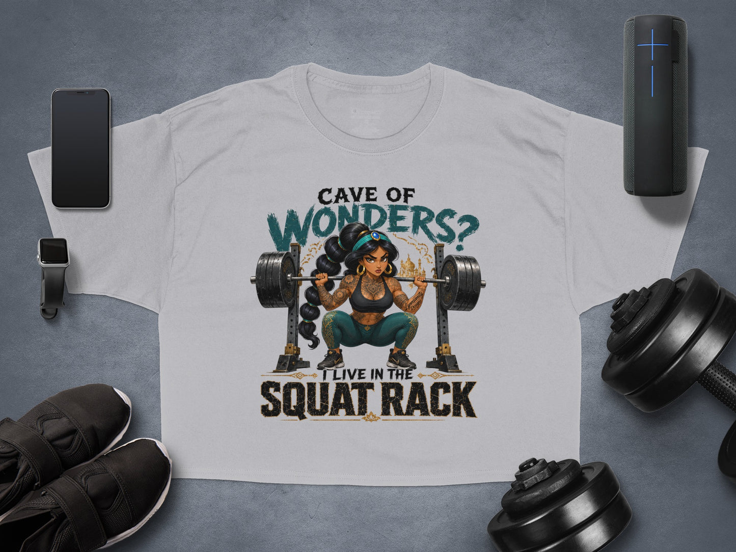 Grey t-shirt with a woman lifting weights and text "Cave of Wonders? I live in the squat rack".