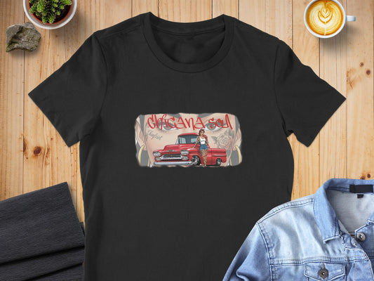 Black t-shirt with graphic of a woman leaning against a red classic truck.
