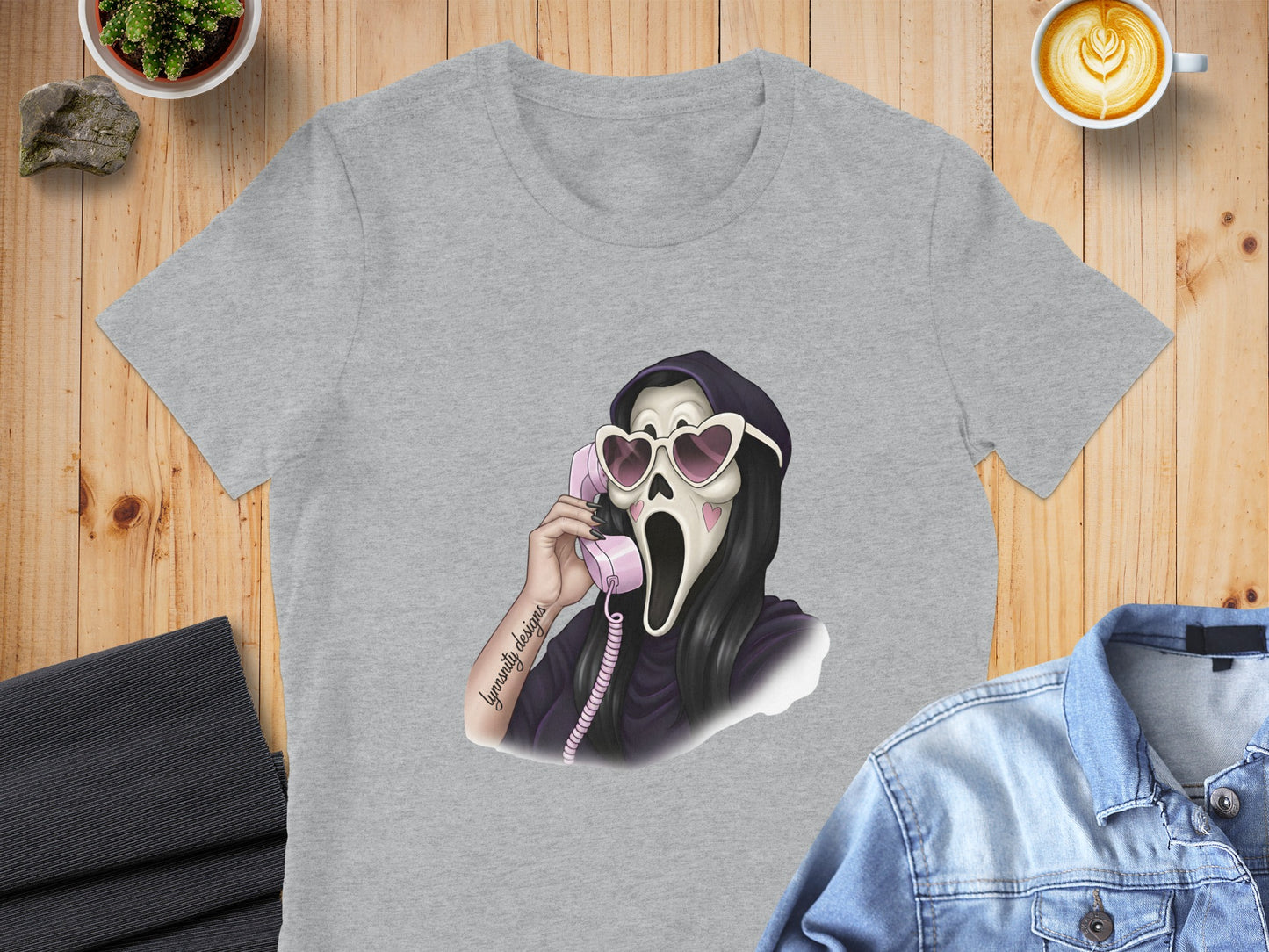 Ghostface wearing heart-shaped sunglasses, talking on a pink phone.