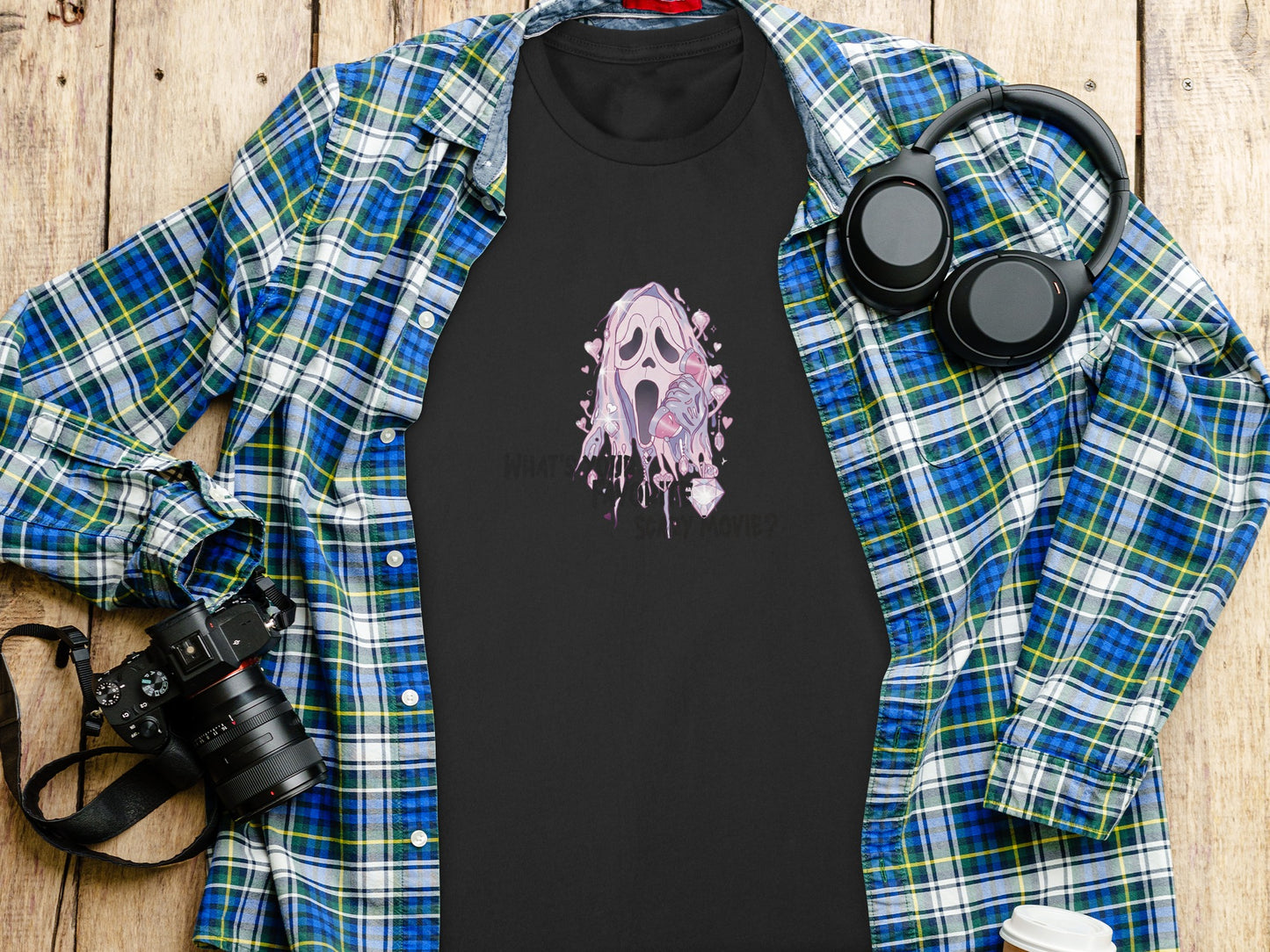 Black t-shirt with Ghostface from Scream in pink, holding an ice cream cone.