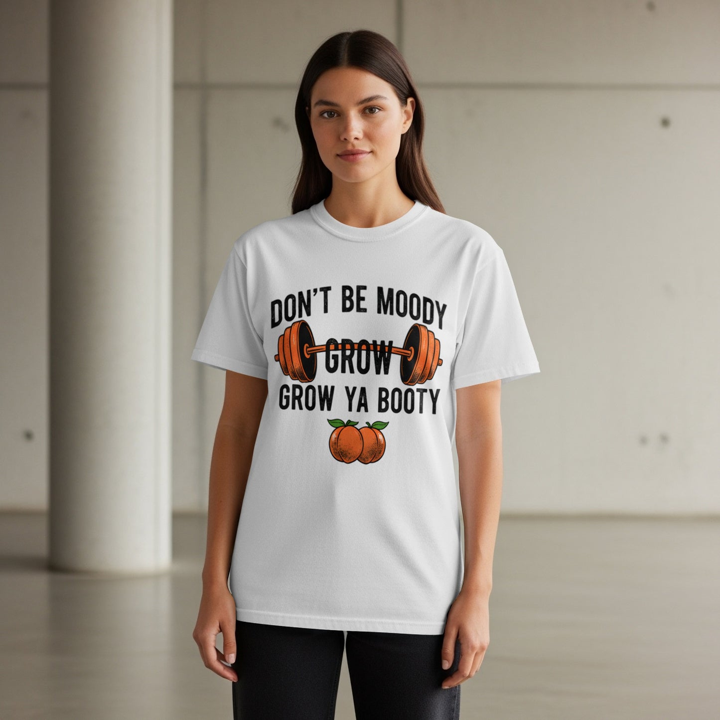 White t-shirt with "DON'T BE MOODY GROW YA BOOTY" text and orange barbell graphic.