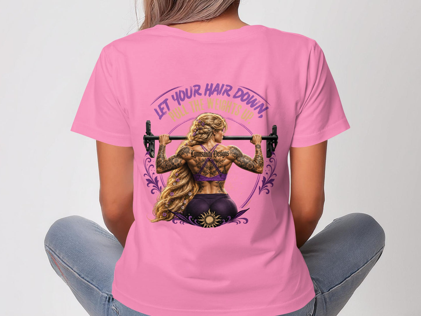 Woman with tattoos lifts a barbell overhead; text reads "Let Your Hair Down, Roll The Weights Up".