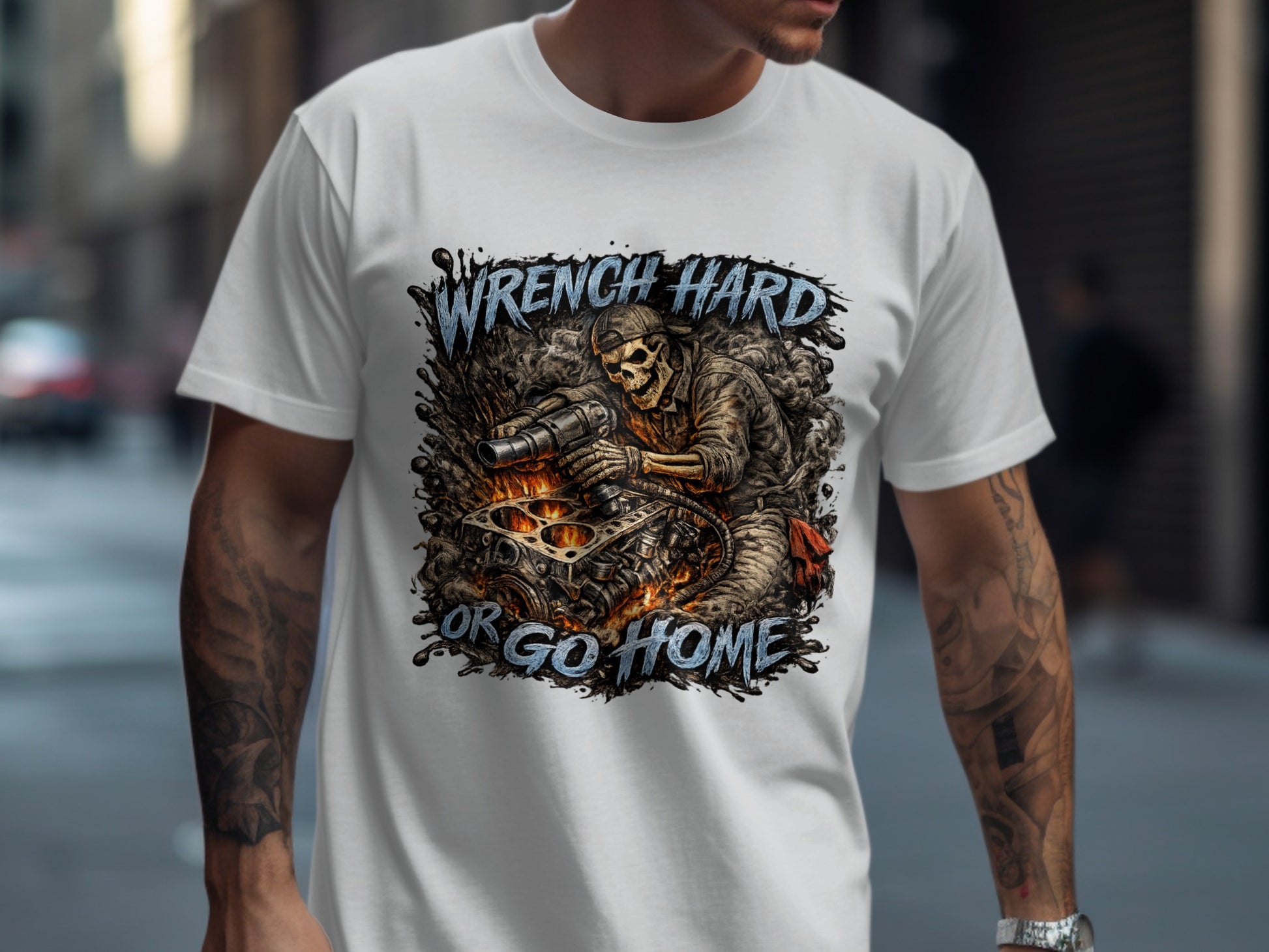 Skeleton mechanic working on engine, text "Wrench Hard Or Go Home".
