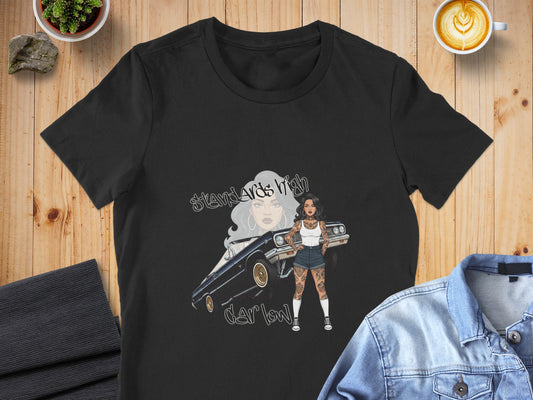 Black t-shirt with graphic of woman and lowrider car, text "Standards High".