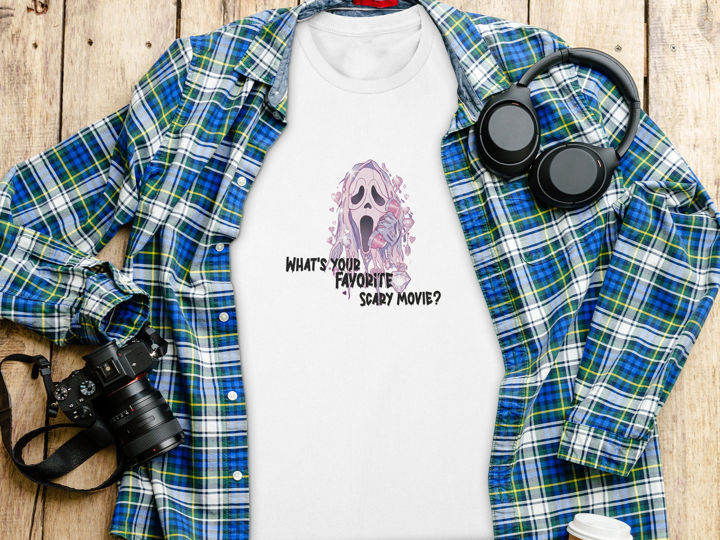 White t-shirt with Ghostface design and text "What's Your Favorite Scary Movie?"