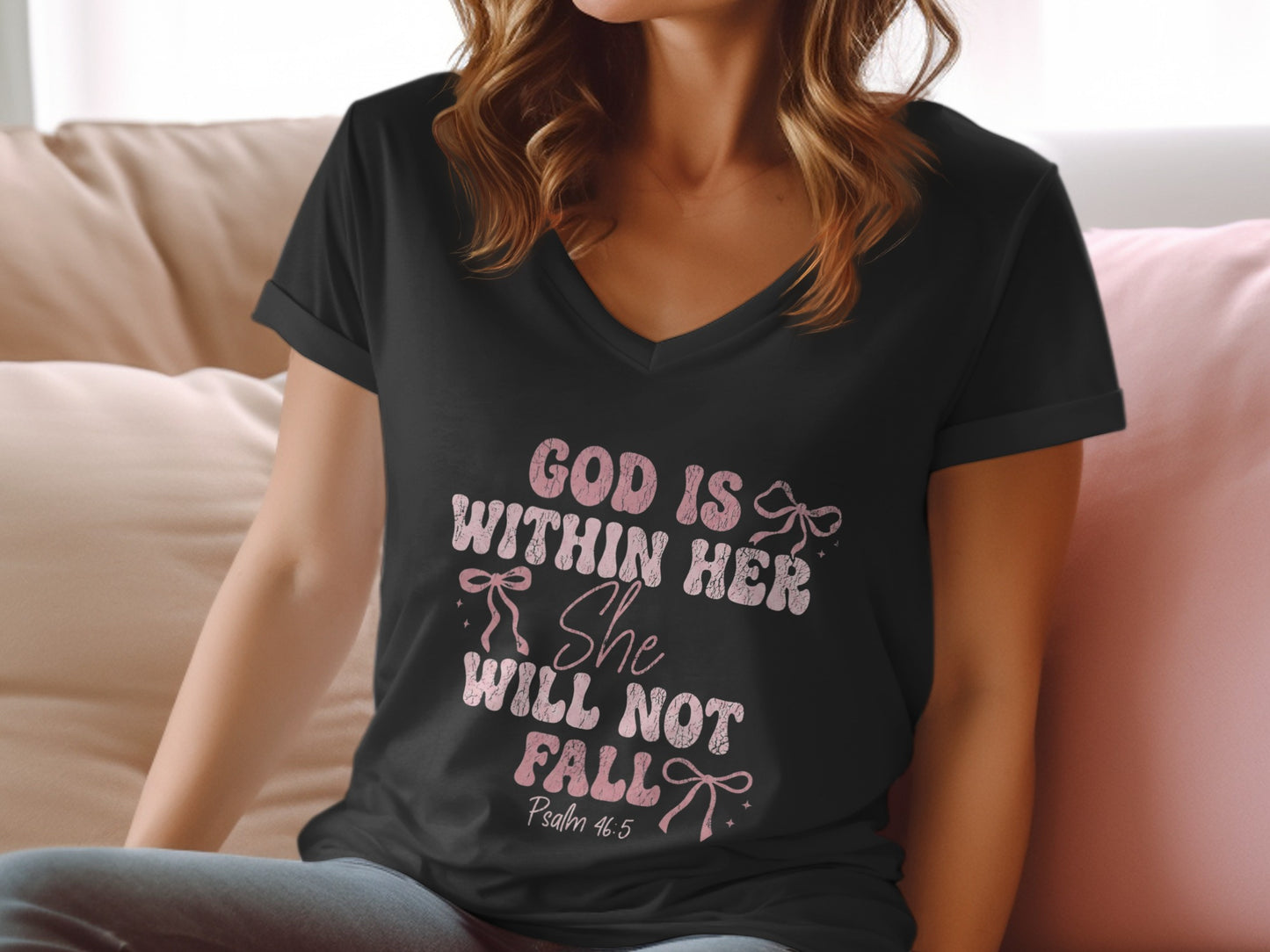Black v-neck t-shirt with "God Is Within Her She Will Not Fall" text.