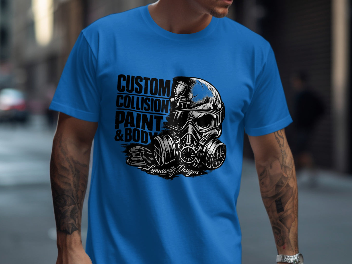 Blue t-shirt with skull wearing gas mask and text "CUSTOM COLLISION PAINT & BODY".