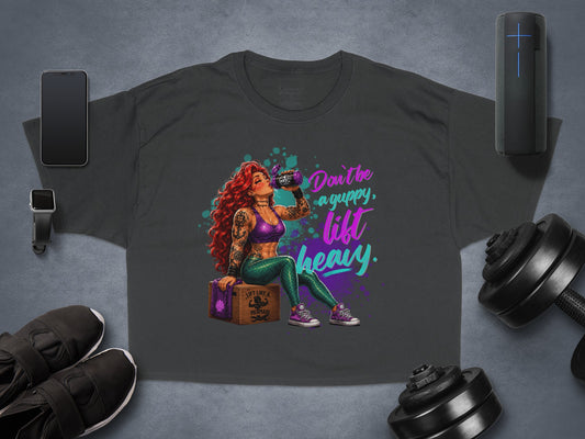 Dark t-shirt with "Don't be a guppy, lift heavy" graphic of a mermaid.