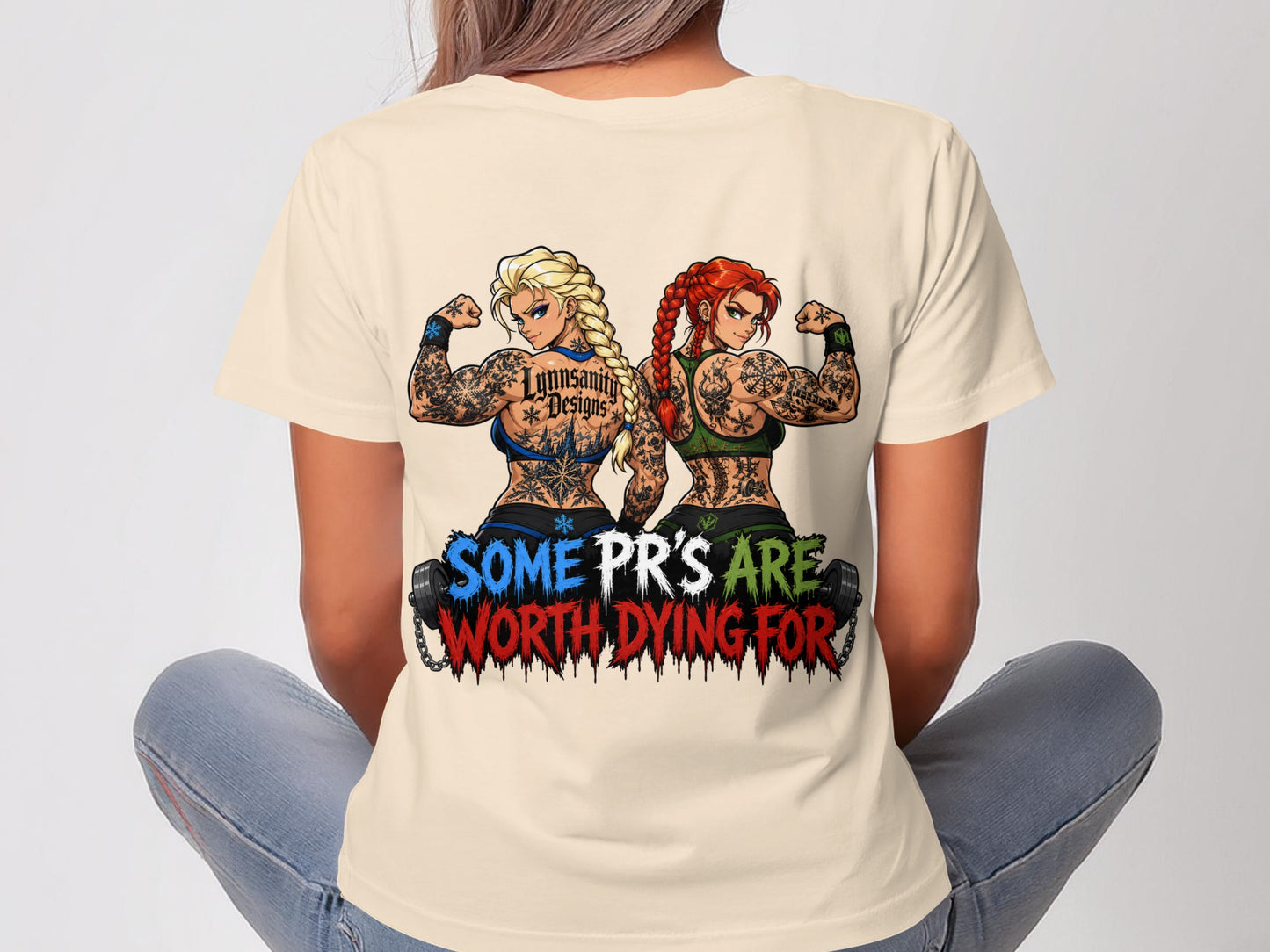 Women in a cream t-shirt with muscular women flexing and "SOME PR'S ARE WORTH DYING FOR" text.