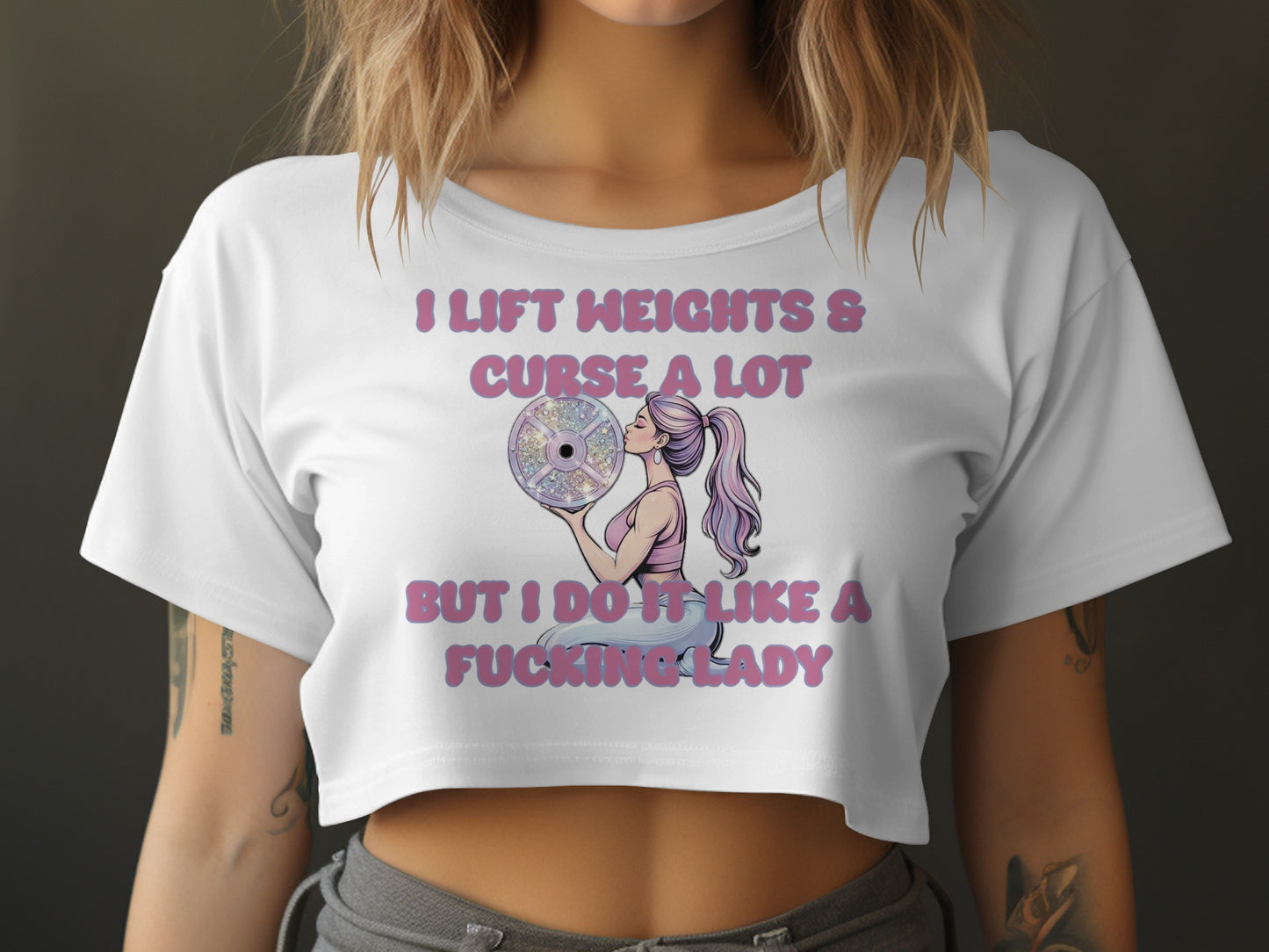 Woman in crop top holding weight plate with text "I lift weights & curse a lot".