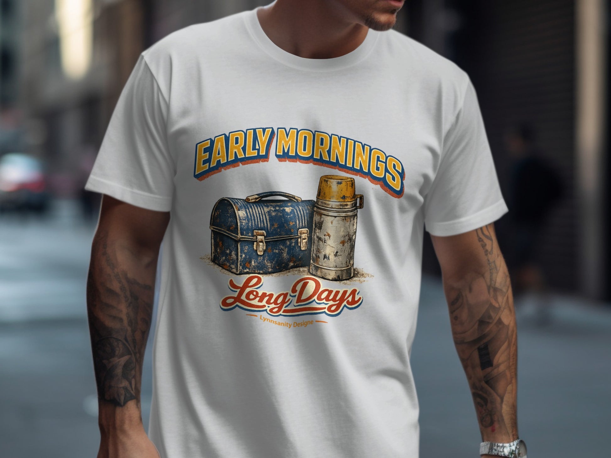 T-shirt with "Early Mornings Long Days" text and vintage lunchbox graphic.