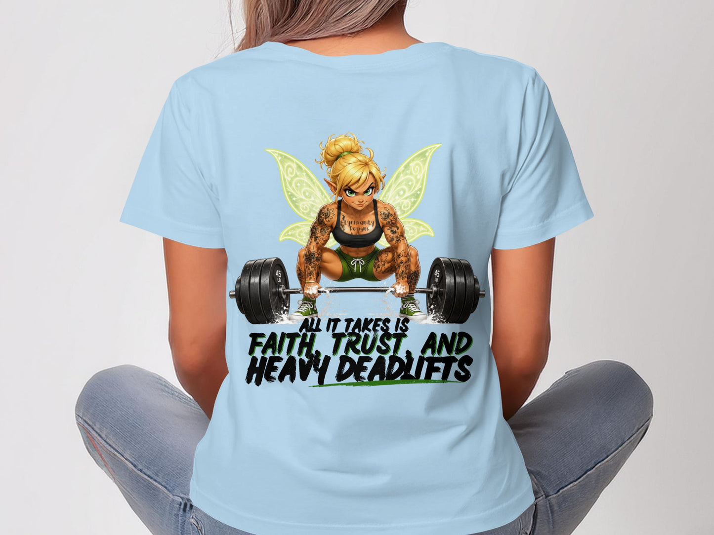 T-shirt with winged figure lifting barbell, text "Lynnsanity Designs" and "All it takes is faith, trust, and heavy deadlifts."