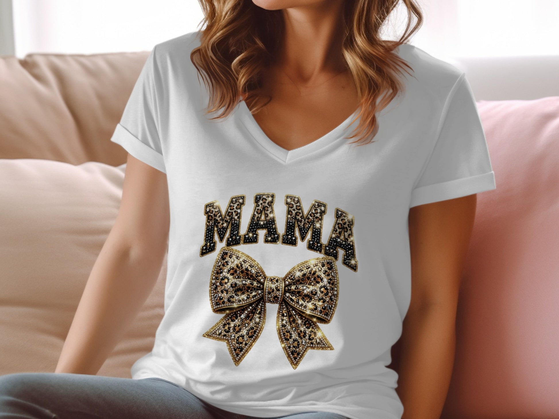 White v-neck t-shirt with "MAMA" and a sparkly leopard print bow.