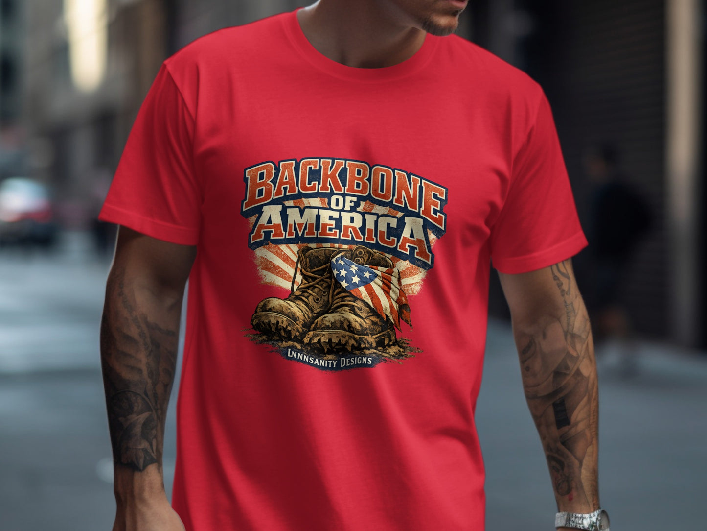 Red t-shirt with "Backbone of America" text over distressed boots and American flag.
