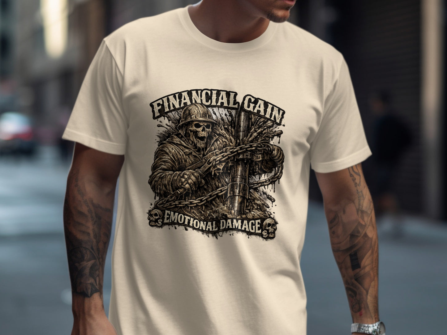 Cream t-shirt with a skull in a helmet, chains, and text "FINANCIAL GAIN EMOTIONAL DAMAGE".