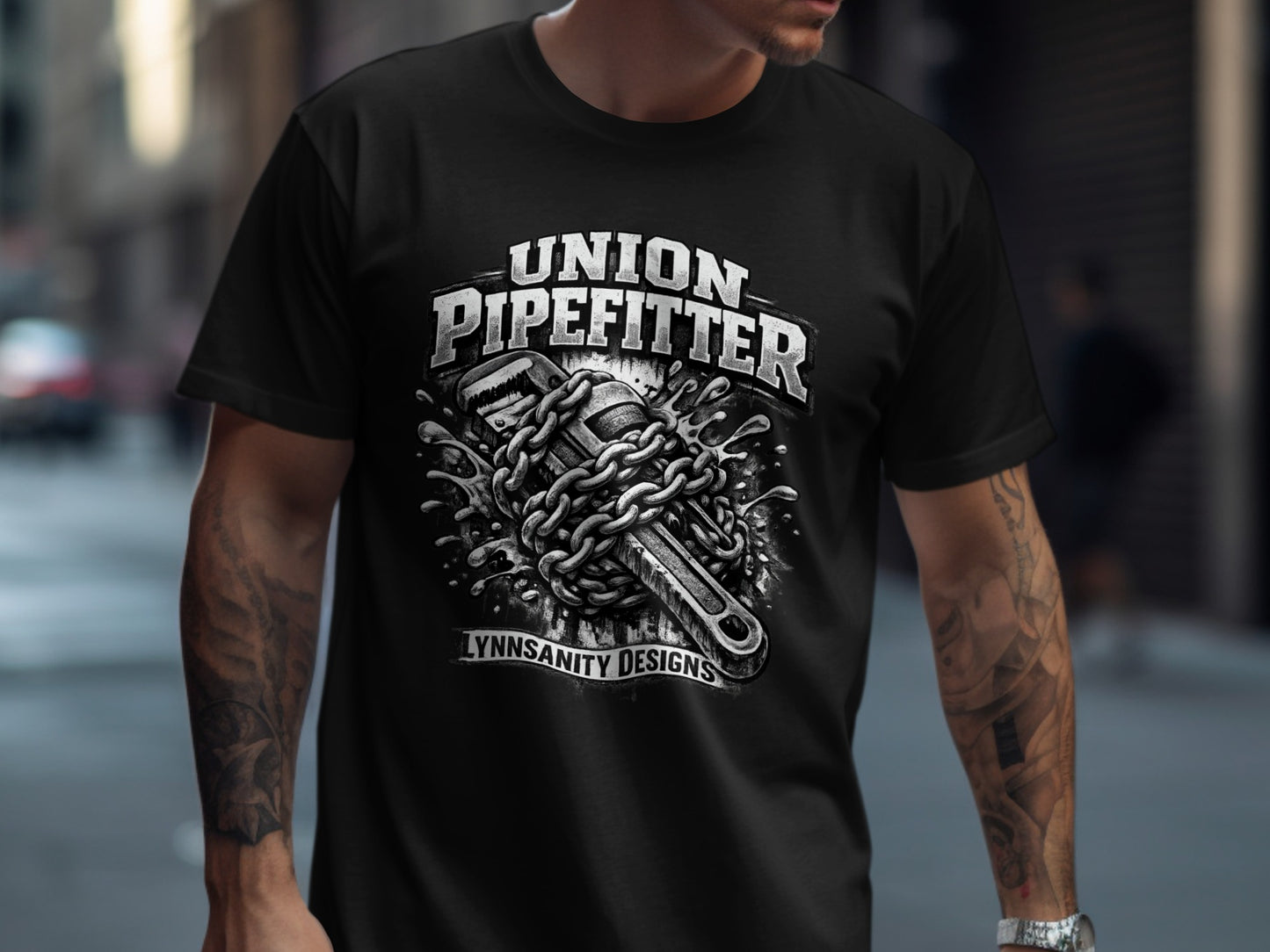 Pipefitter t-shirt with wrench, chains, and water splash design.