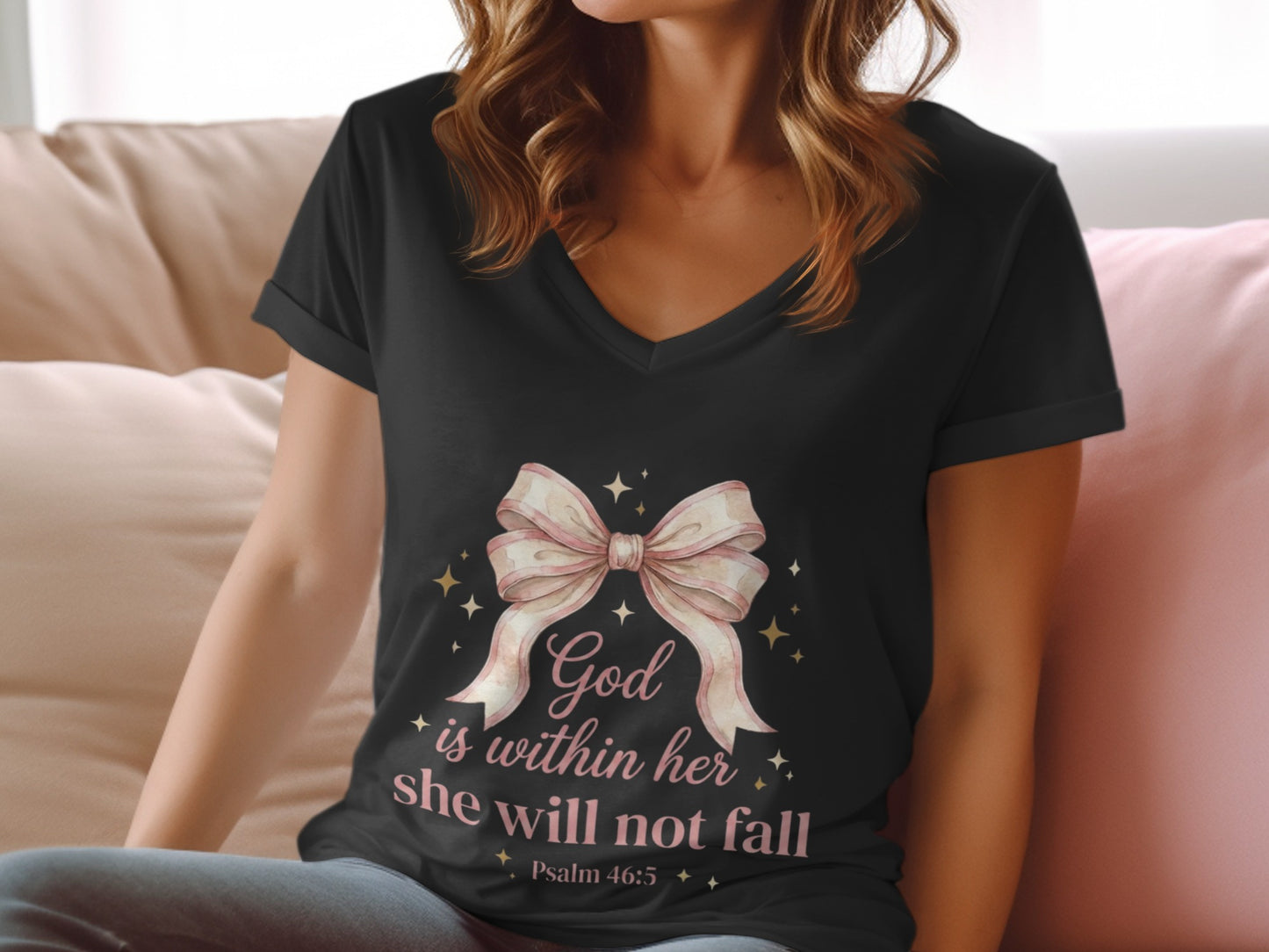 Black v-neck t-shirt with pink bow and "God is within her, she will not fall" text.