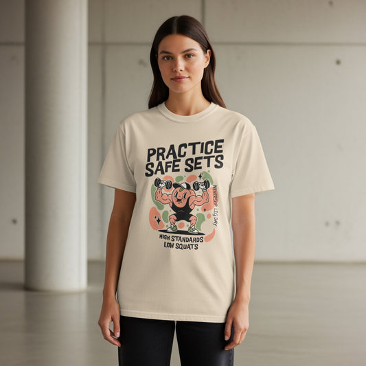 Cream t-shirt with cartoon weightlifter graphic and text "PRACTICE SAFE SETS".