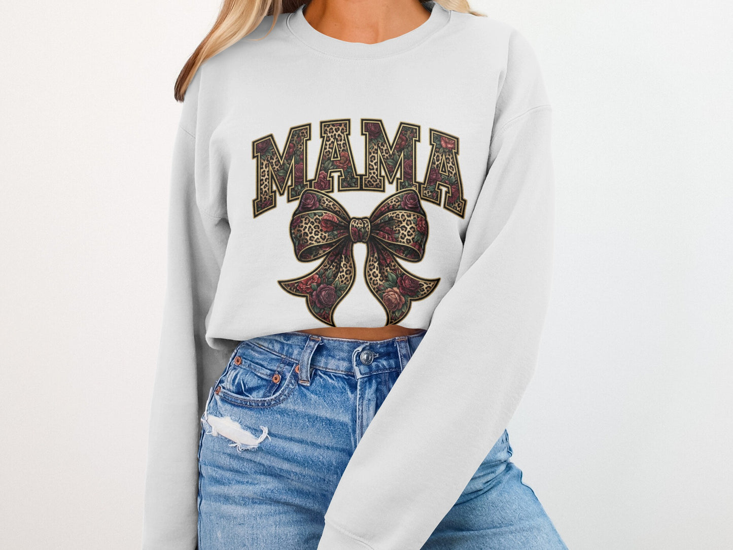 White sweatshirt with "MAMA" text and floral leopard print bow graphic.