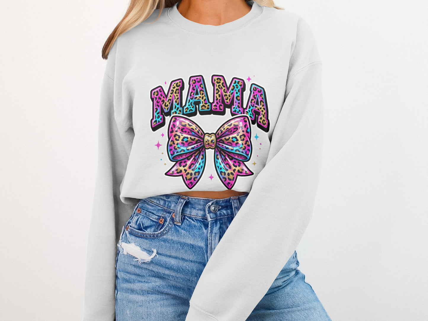 White sweatshirt with "MAMA" text and a colorful leopard-print bow.