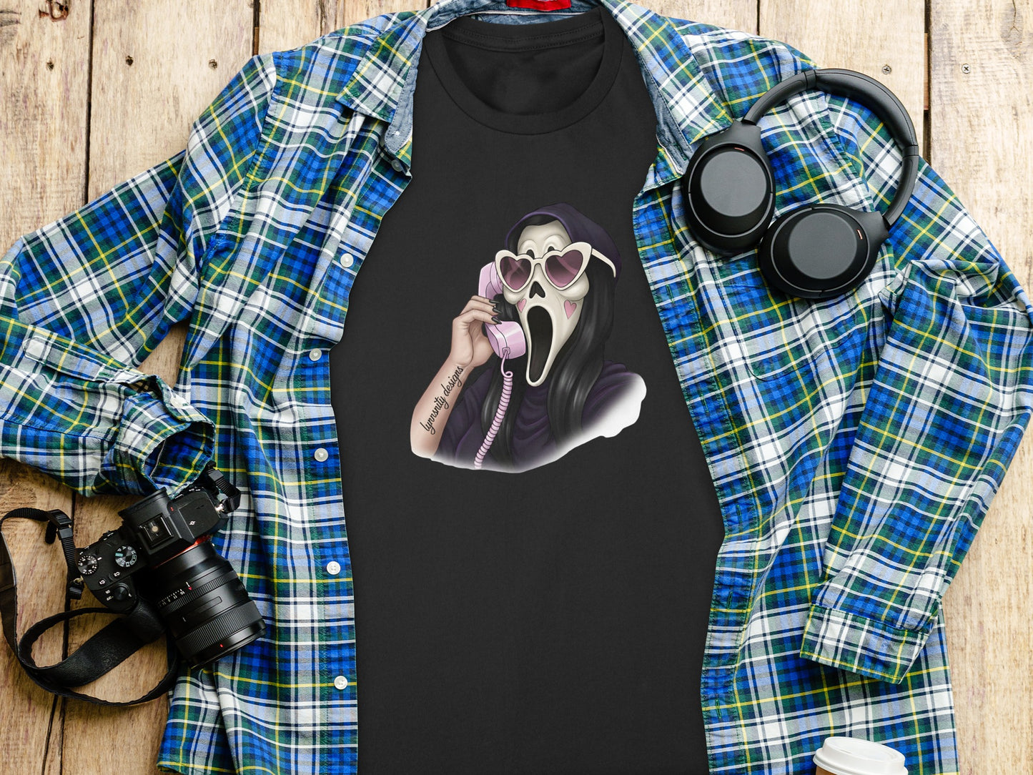 Black t-shirt featuring Ghostface with heart sunglasses holding a pink phone.