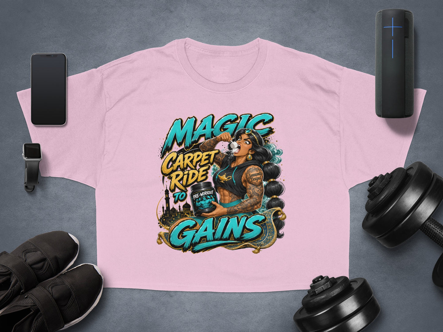 Pink t-shirt with "Magic Carpet Ride to Gains" text and woman holding pre-workout.