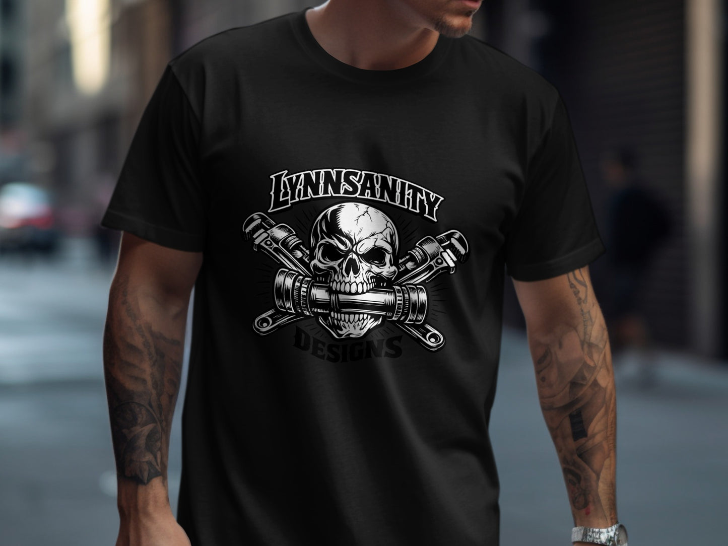 Black t-shirt with a skull and cross wrenches logo, "LYNNSANITY DESIGNS".